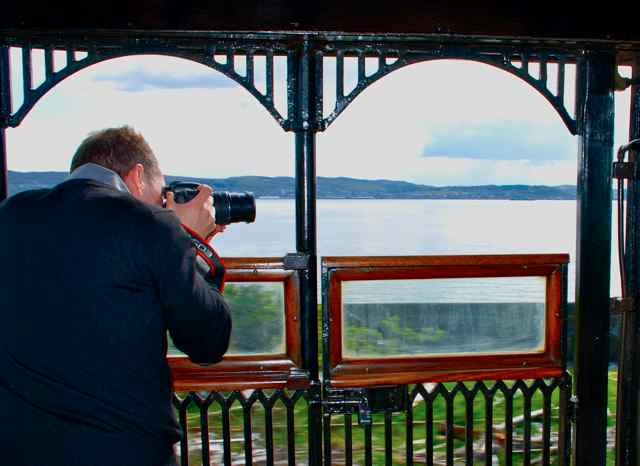 Taking the perfect photo on the Royal Scotsman's outdoor rear platform. IRT photo by Eleanor Hardy