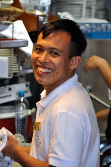 Sea Cloud crew member cleaning up in the galley after lunch. IRT Photo by Owen Hardy