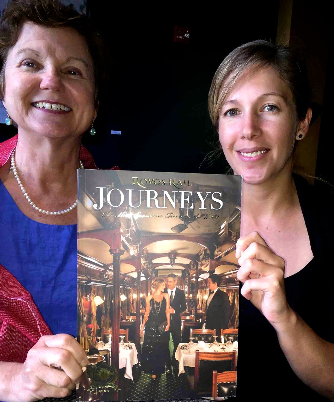 IRT Society President Eleanor Hardy and Rovos Rail's Alicia Taljaard pose with the company's lavish 