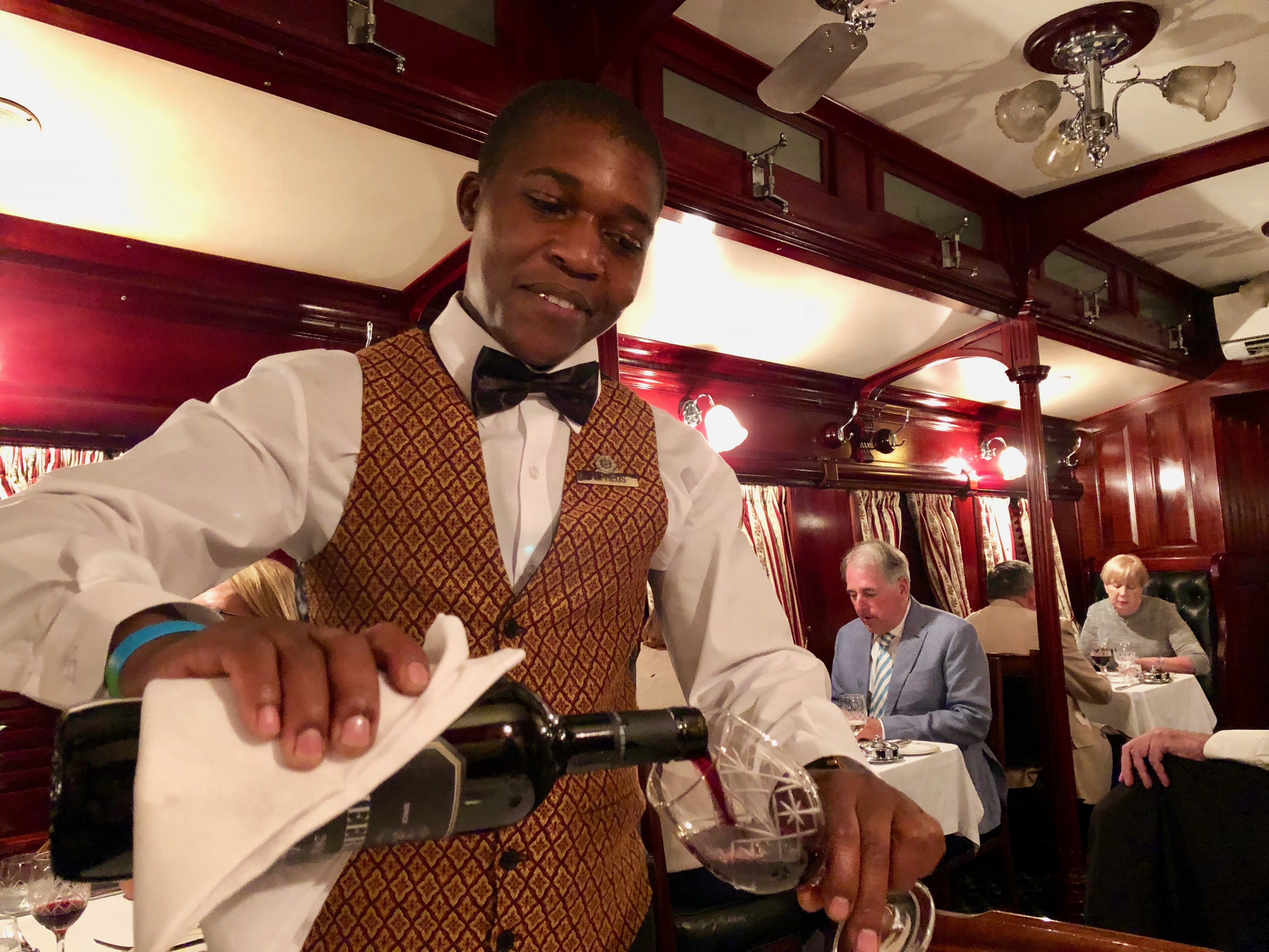 Alpheus pours wine.jpg