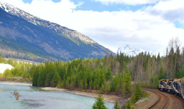 Rocky Mountaineer_River with train REV