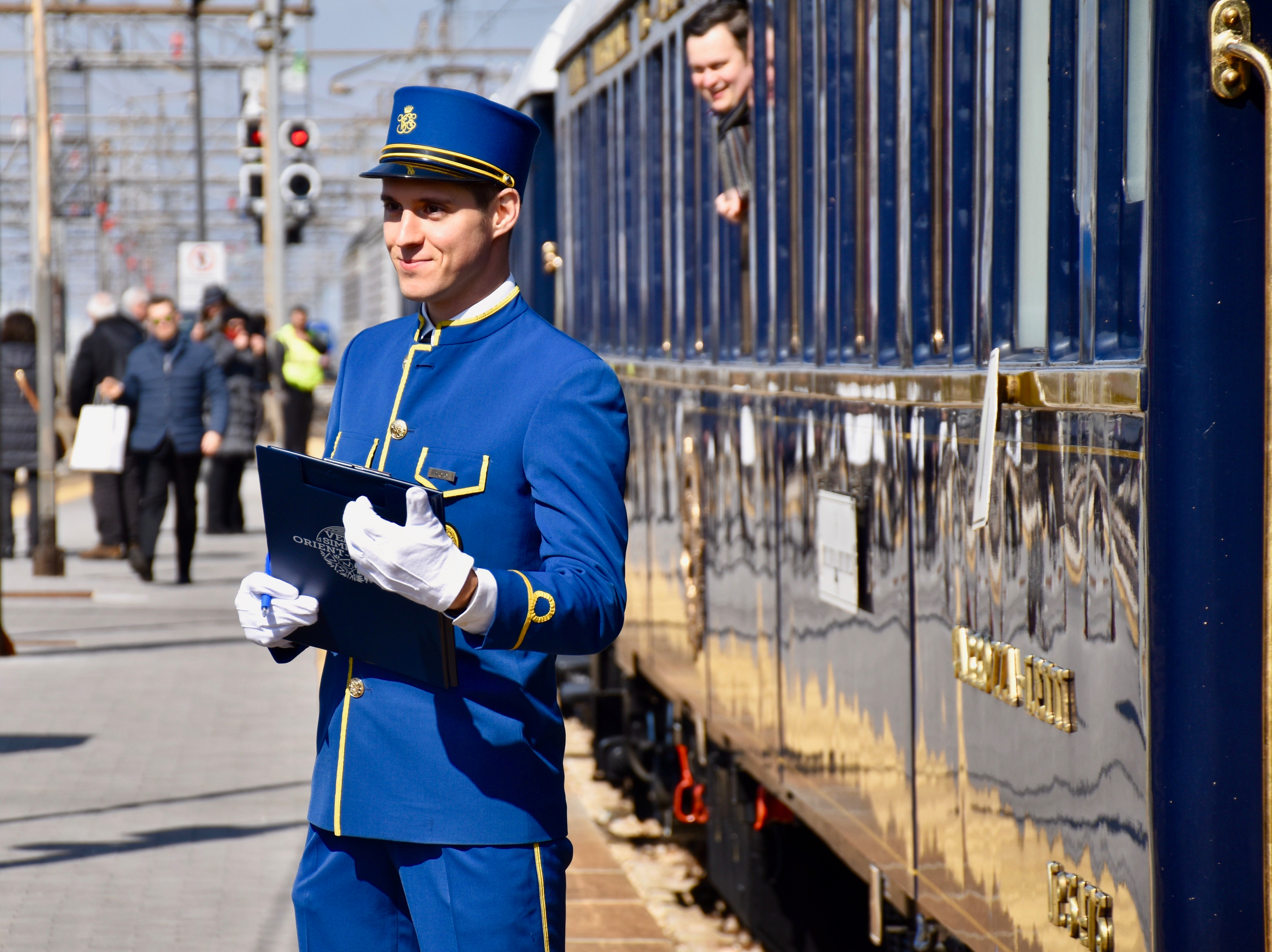 Steward outside train